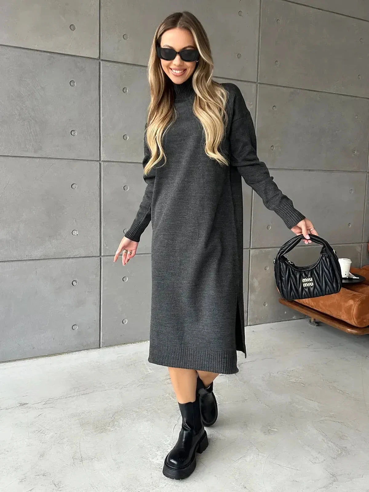 Asteria Midi Dress by Lauven, showcasing cozy knit elegance with a high ribbed collar and side slit.