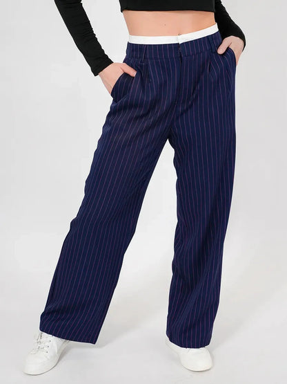 Aster Pants by Lauven showcasing refined high-waist wide-leg silhouette in navy with elegant pinstripes.