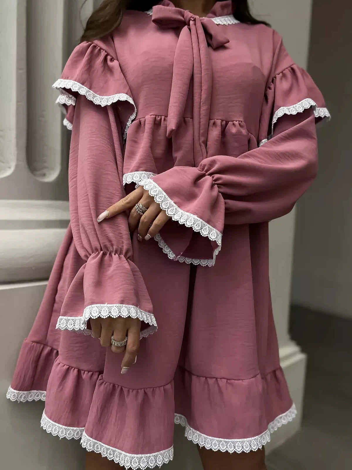 Rosea Mini Dress by Lauven, featuring elegant ruffles, lace detail, and a soft pink color for modern sophistication.