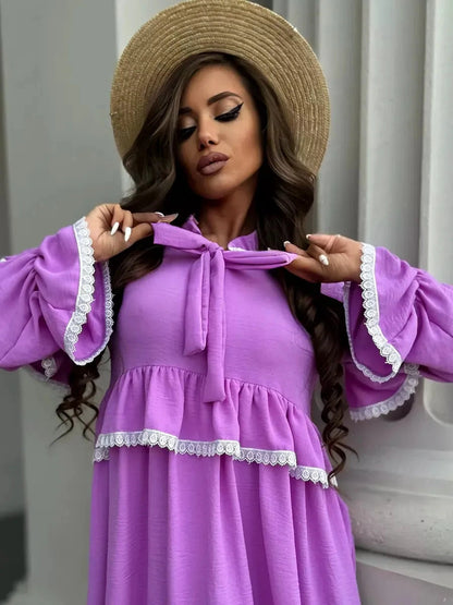 Violetta Mini Dress by Lauven featuring delicate lace and flowing ruffles in lilac color.