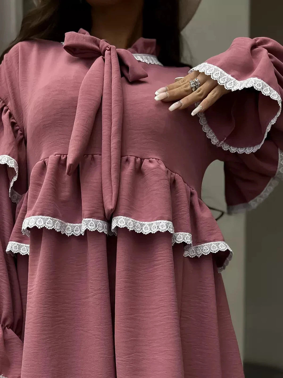 Rosea Mini Dress by Lauven showcasing elegant ruffles and lace detail, perfect for modern feminine styles.