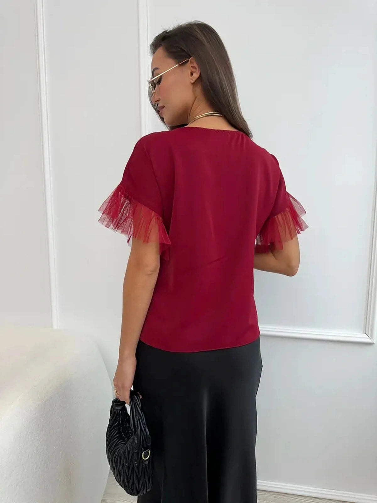 Velora Blouse by Lauven in burgundy with sheer ruffle sleeves, showcasing lush design and elegant back view.