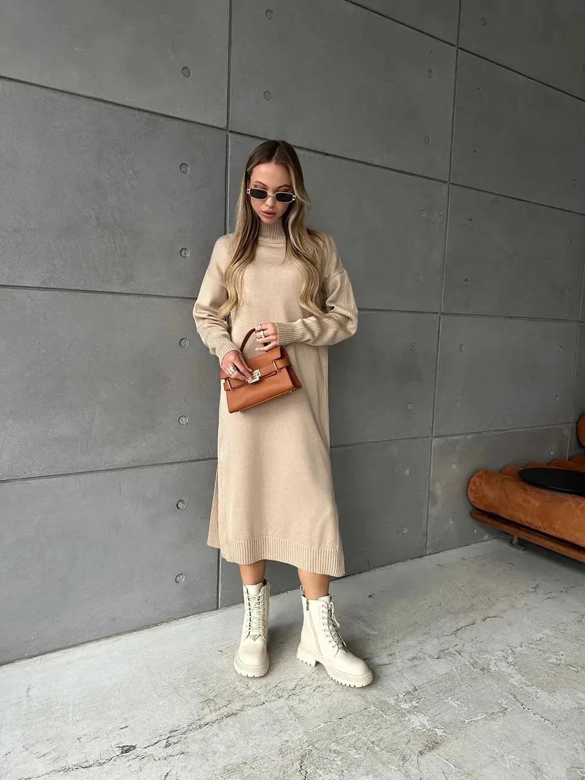 Seren Midi Dress by Lauven, showcasing minimalist knit elegance in beige with a high-neck collar and relaxed silhouette.