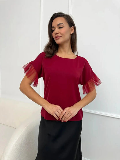 Velora Blouse by Lauven in burgundy with sheer ruffle sleeves, showcasing elegance and comfort.