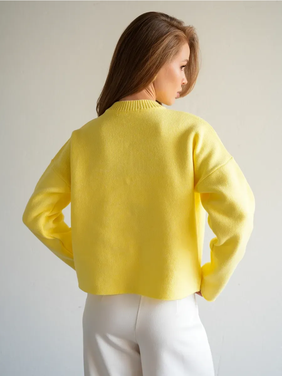 Lemonade Cardigan by Lauven in warm yellow showing back detail, perfect for stylish school and office wear.