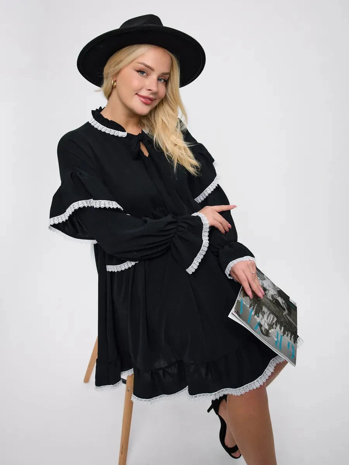 Noiré Mini Dress by Lauven, featuring elegant ruffles and lace trim, perfect for modern elegance and comfort.