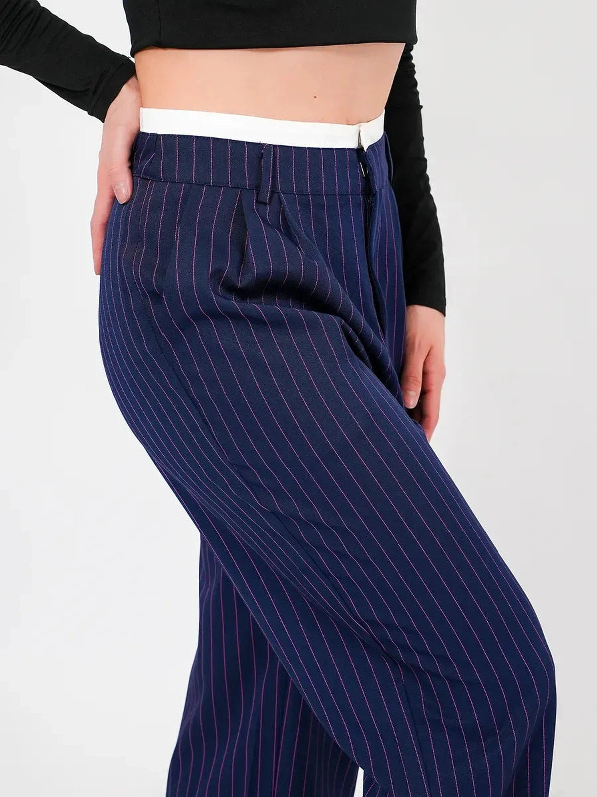 Aster Pants by Lauven, featuring a high-waist, wide-leg silhouette in navy with elegant vertical pinstripes.