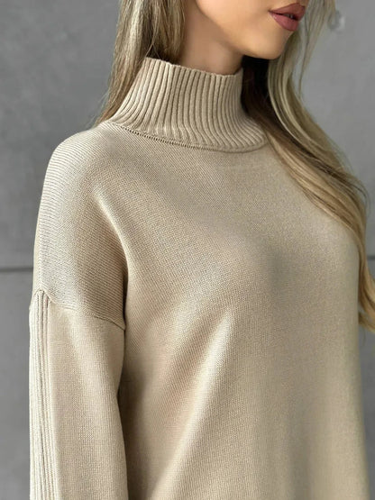 Close-up of a woman wearing the Seren Midi Dress by Lauven, featuring a soft high-neck collar in classic beige.
