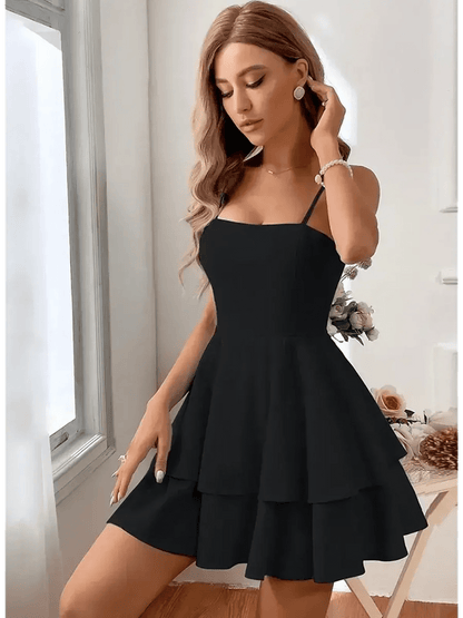 Noir Bloom Mini Dress in black, featuring tiered flounce skirt and adjustable straps, exuding elegance and femininity.