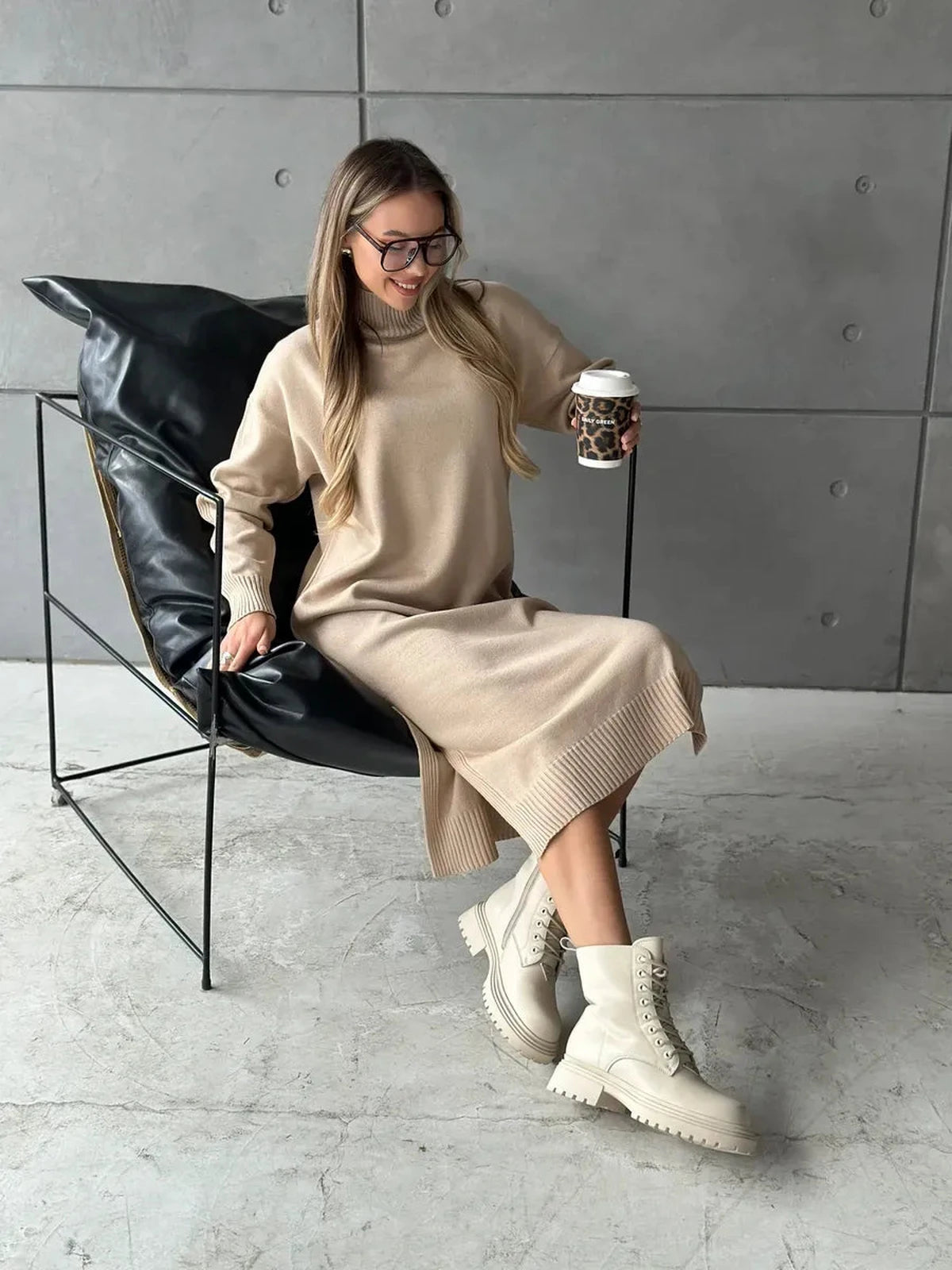Woman wearing the Seren Midi Dress by Lauven, showcasing minimalist knit sophistication in classic beige.