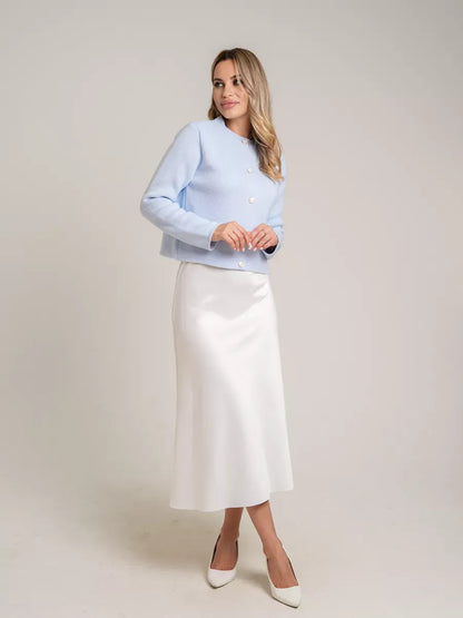 Celeste Cardigan by Lauven in light blue, featuring decorative buttons, perfect for autumn elegance.