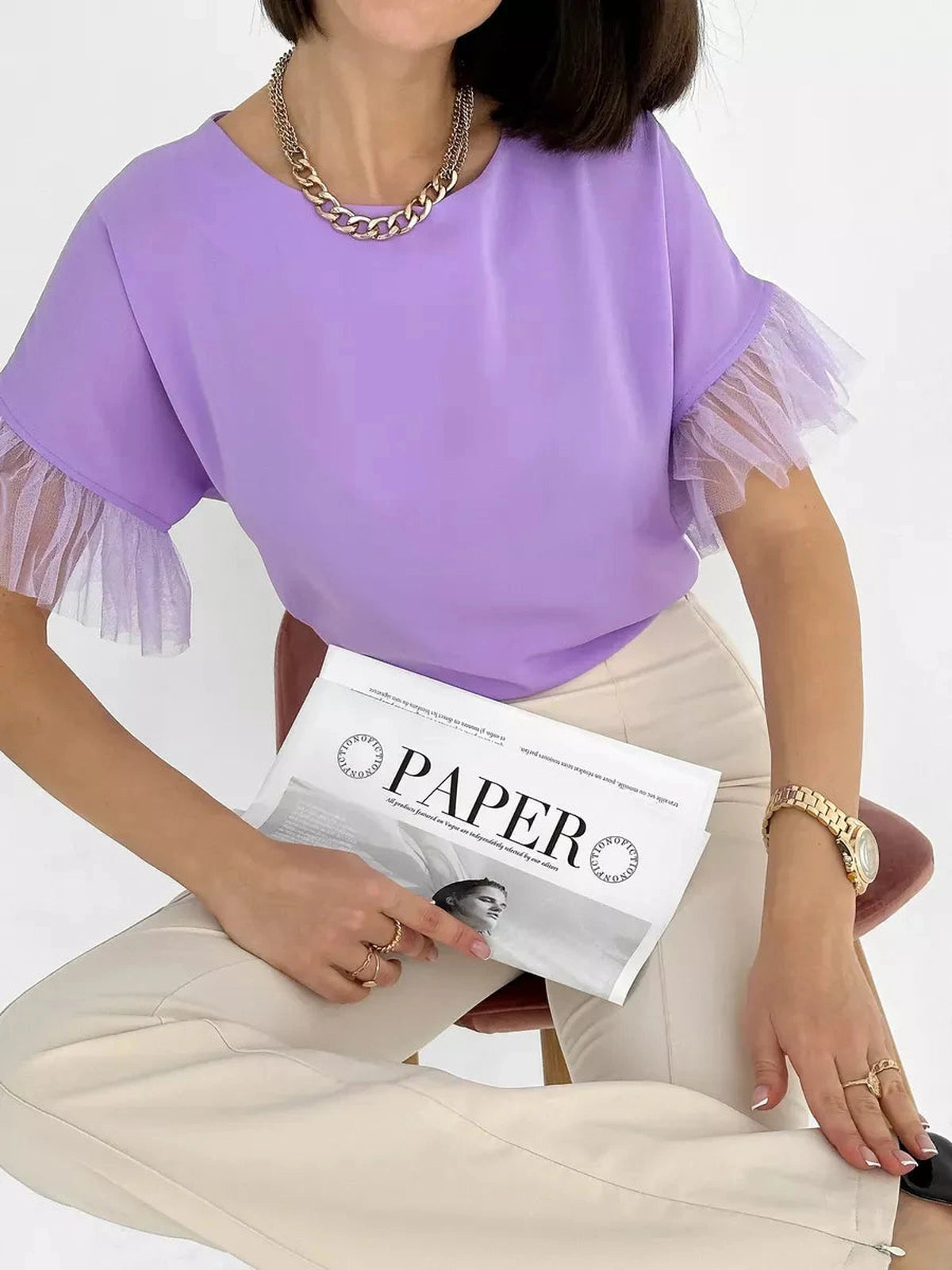 Lavande Blouse by Lauven - Lilac short sleeve blouse with sheer ruffle detail, styled with neutral pants.