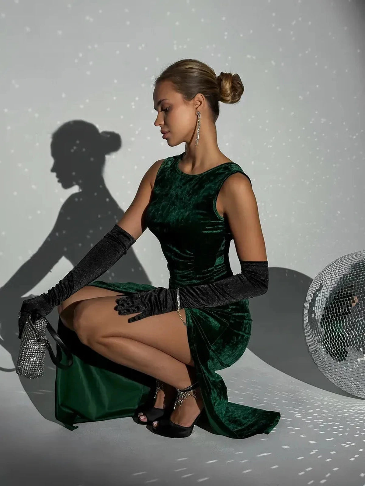 Emeralda Maxi Dress by Lauven in luxurious emerald green velvet, showcasing elegant draping and a high slit.