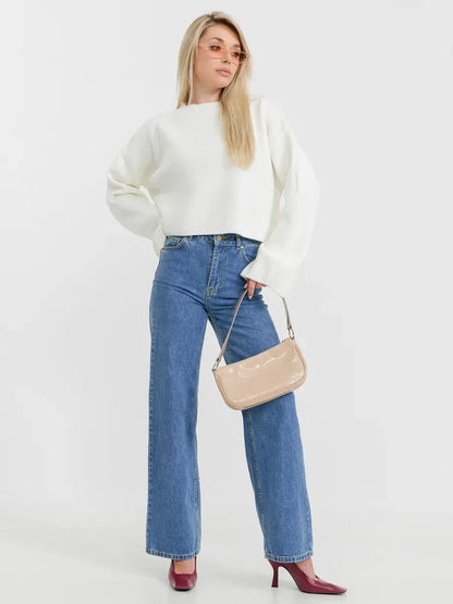 Luna Sweater by Lauven styled with wide-leg jeans and a handbag for a chic look.