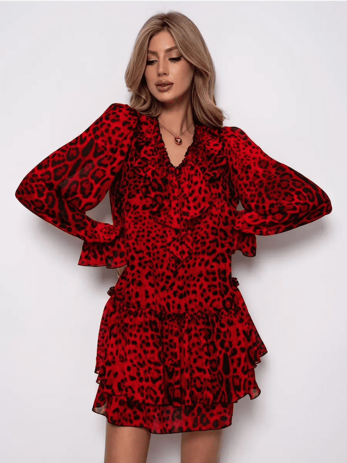 Savanna Mini Dress by Lauven featuring bold red leopard print chiffon and elegant ruffled sleeves.