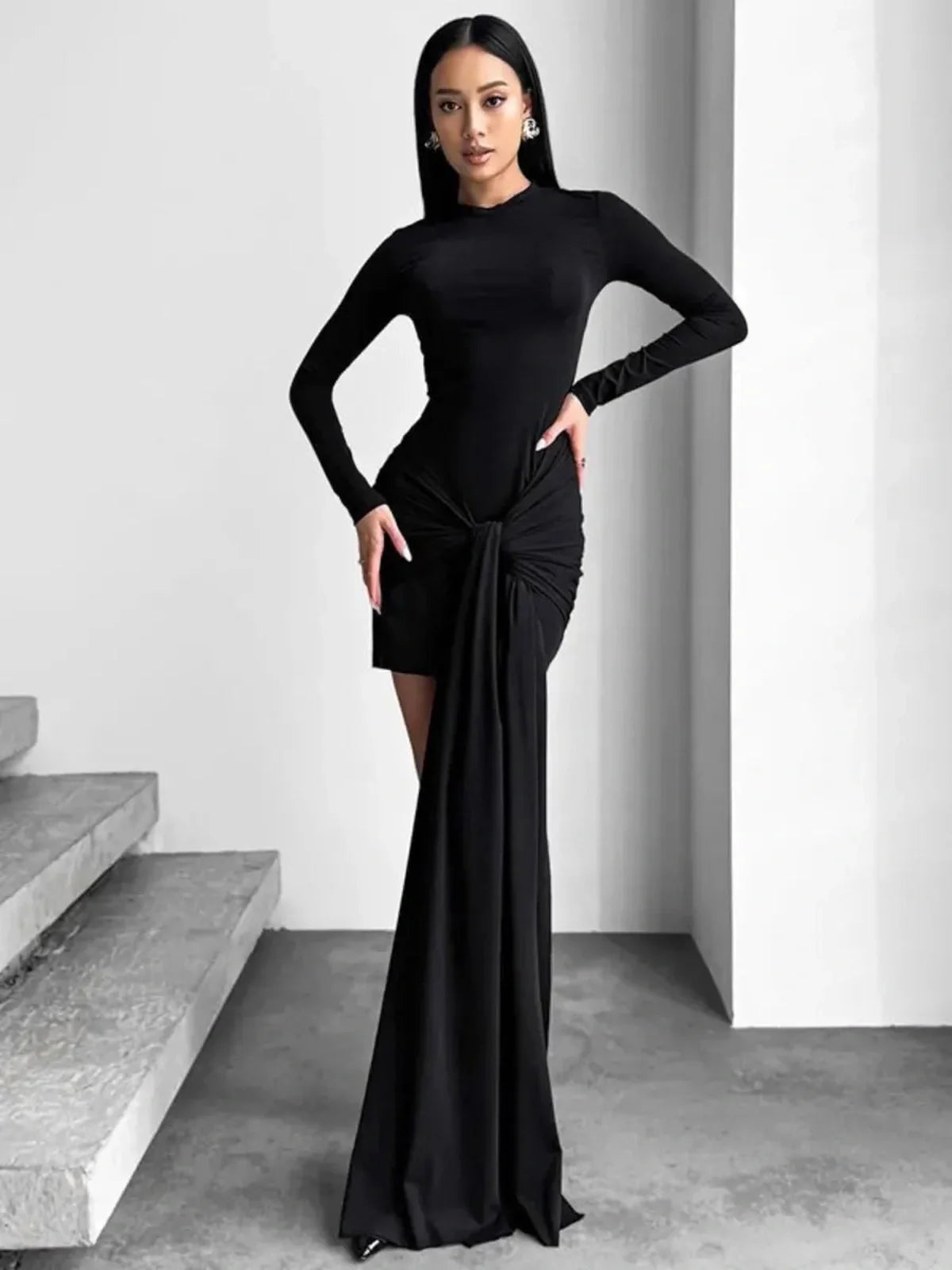 Obsidian Veil black mini dress featuring a structured waist and dramatic draping for a sultry silhouette.