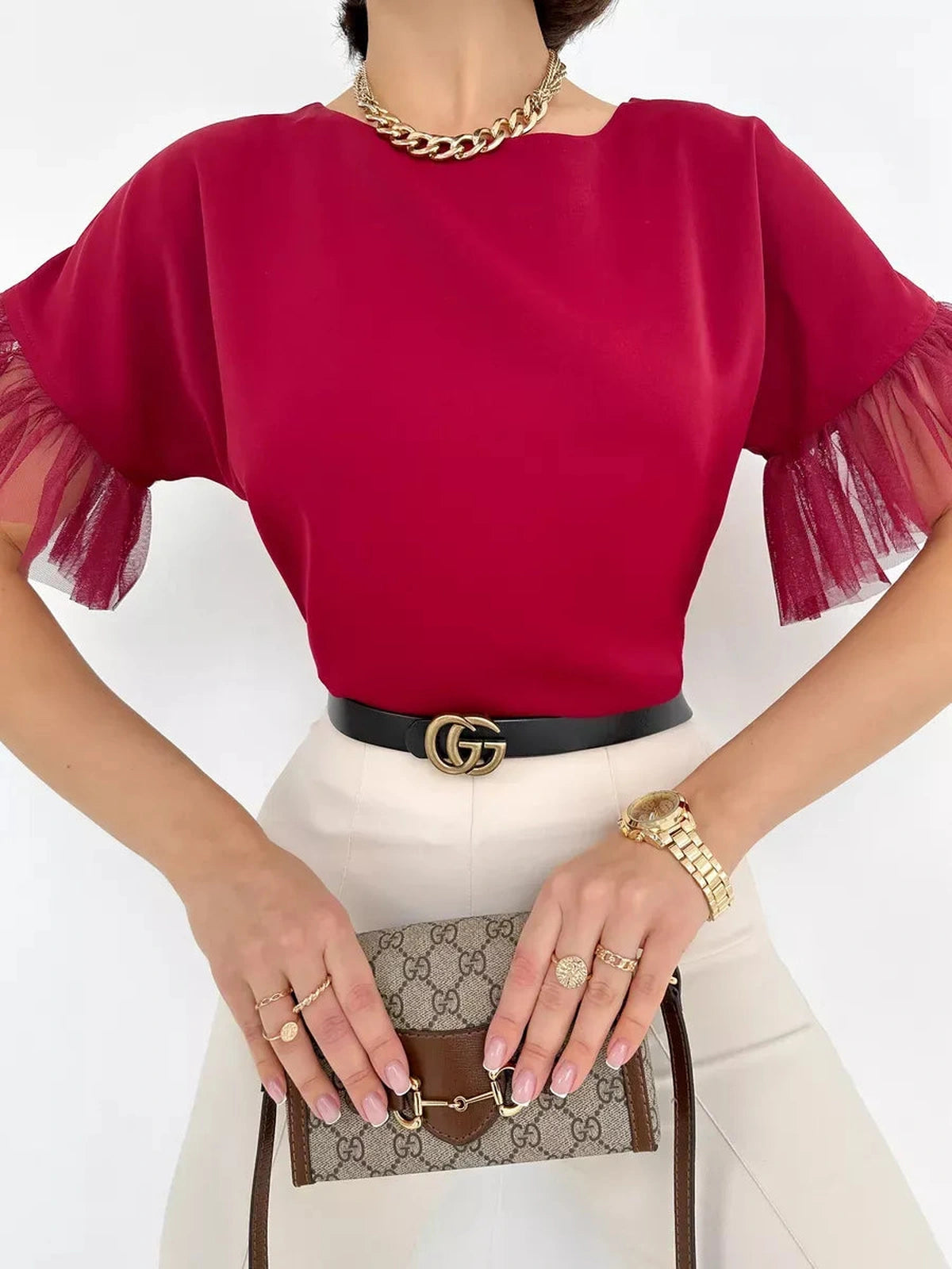 Velora Blouse by Lauven featuring a burgundy short sleeve design with sheer ruffle sleeves and elegant accessories.