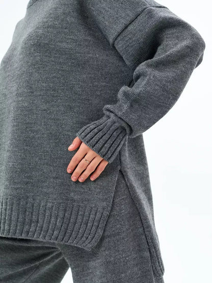 Orion Sweater by Lauven in oversized wool blend knit, showcasing a cozy graphite gray color and stylish side slit.