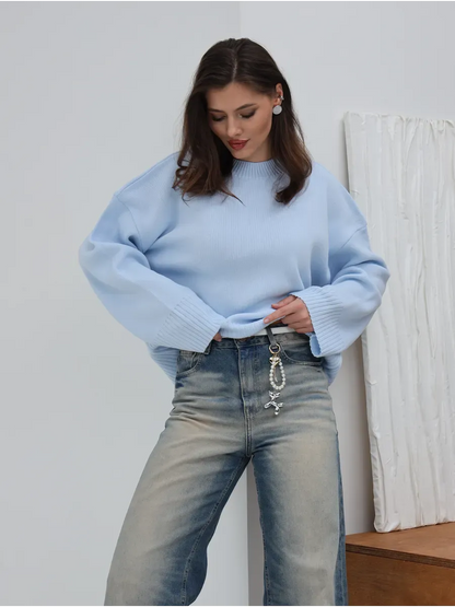 Celine Sweater by Lauven in oversized knit, stylishly worn with denim, showcasing a chic sky blue design.