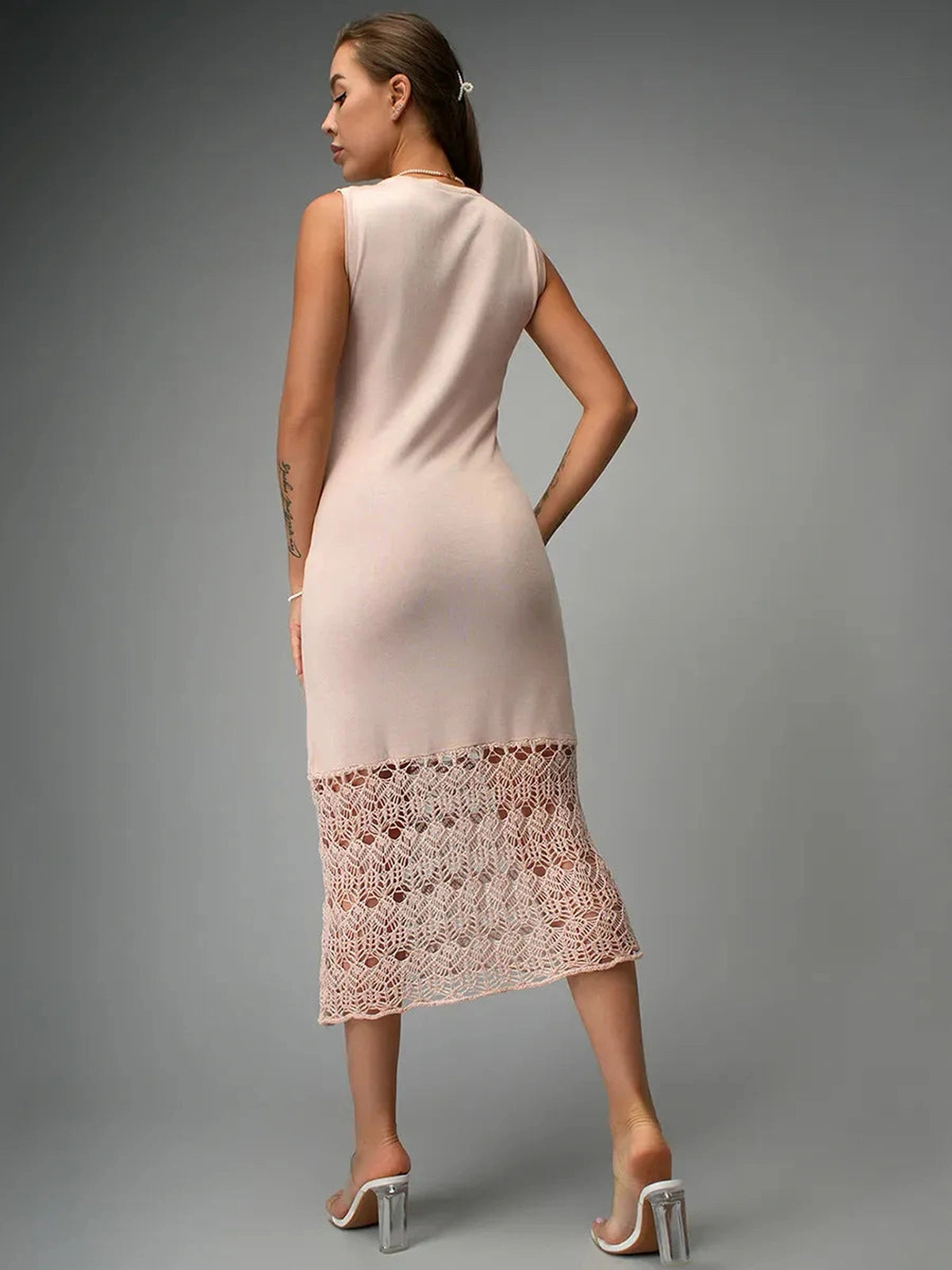 Elara Midi Dress by Lauven, showcasing a beautiful beige knit design with romantic crochet detailing from the back.