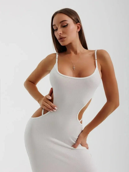 Model showcasing the Midi Dress Cutout Muse, featuring a sleek silhouette and alluring side cutouts in a textured rib knit.