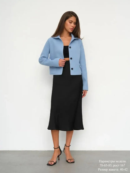 Lazio Jacket by Lauven - Cropped light blue women's jacket with button closure, styled with a black dress.