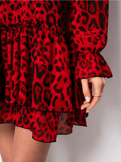 Savanna Mini Dress by Lauven, featuring red leopard chiffon fabric and a playful ruffled hem, perfect for bold elegance.