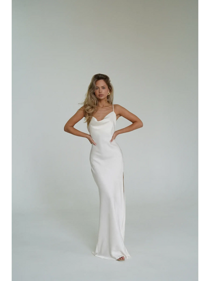 Ivory Luxe Maxi Dress featuring a silky drape, cowl neckline, and side slit, perfect for summer elegance.