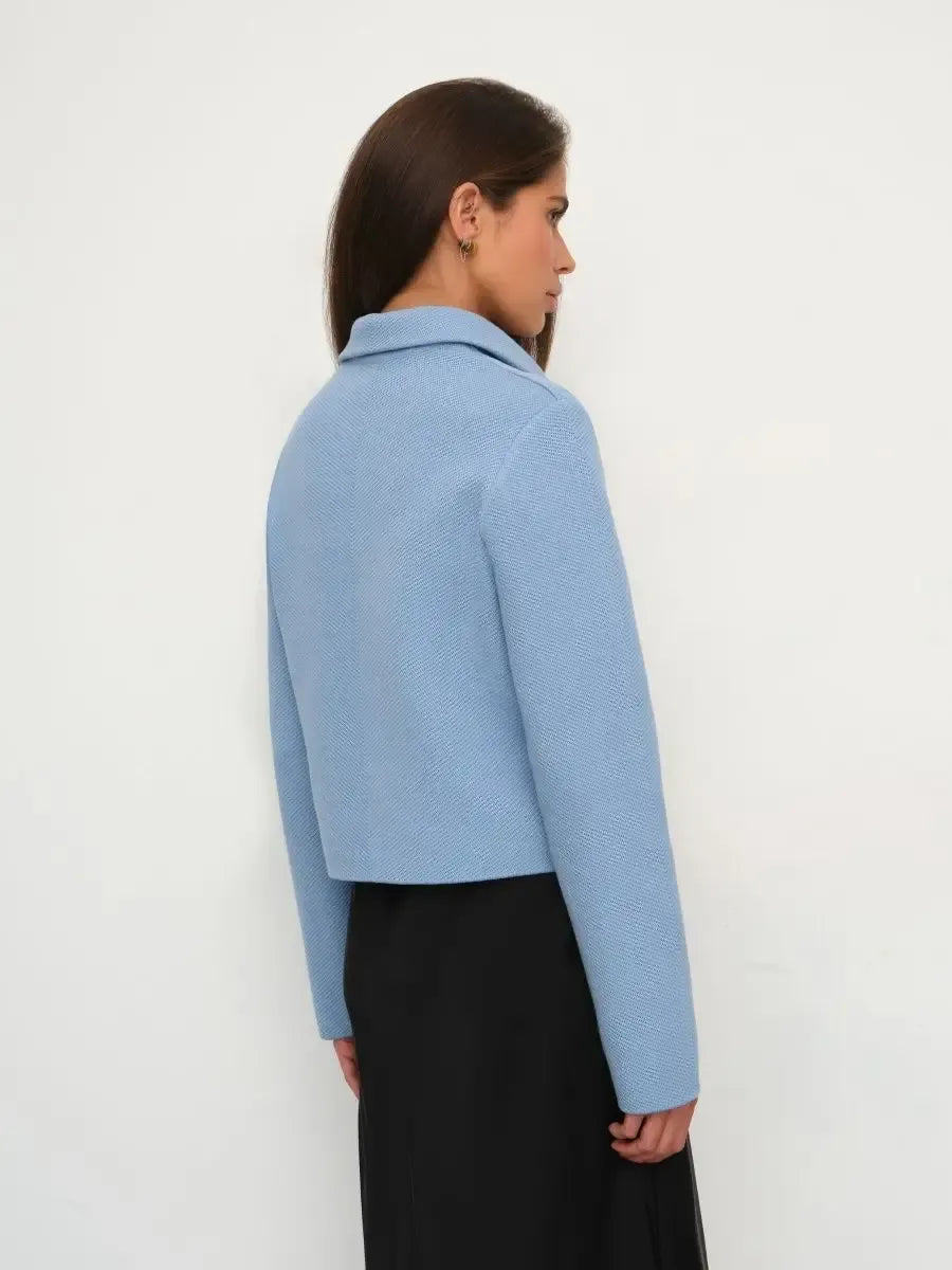 Lazio Jacket by Lauven, cropped light blue women's jacket showcasing a structured silhouette from the back.
