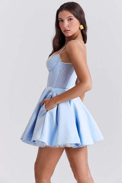 Light blue Inez Mini Dress with a fluffy skirt and pockets, perfect for summer parties or formal events.