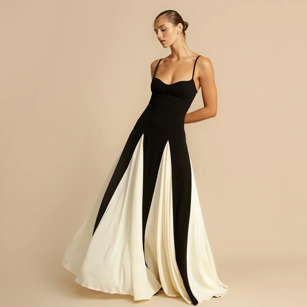 Isla Women's Maxi Dress featuring a black top and flowing cream skirt, perfect for wedding guest or formal occasions.