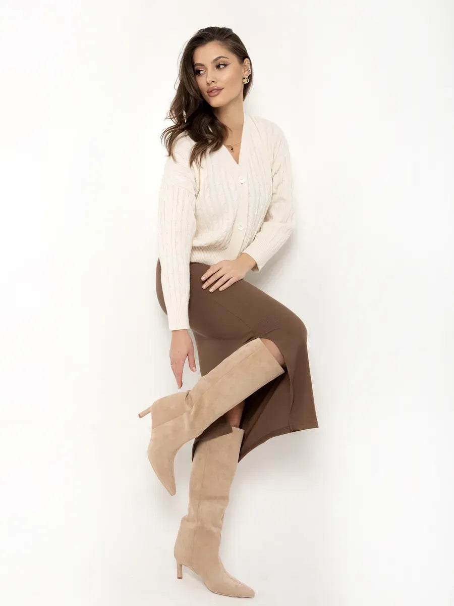 Isola Cardigan by Lauven styled with a brown skirt and beige boots, showcasing a chic, cropped cream knit design.