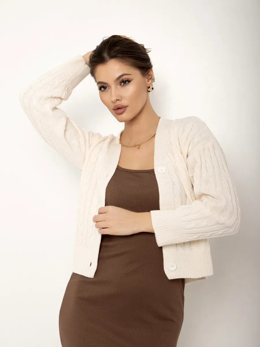Isola Cardigan by Lauven, cropped cream knit cardigan with button closure, styled for effortless elegance.