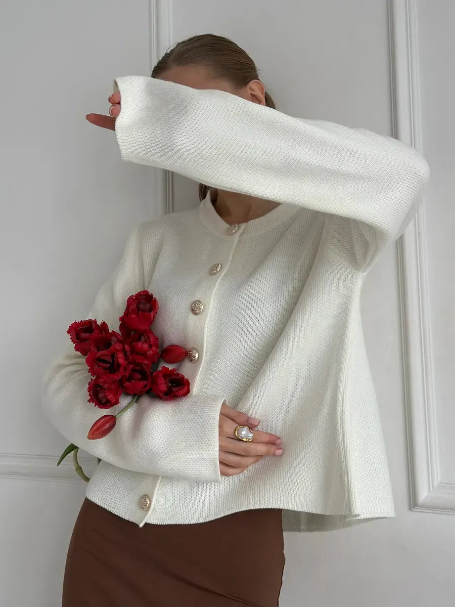 Ivory Cardigan by Lauven, elegant cropped knitwear worn with flowers, showcasing warmth and stylish comfort.