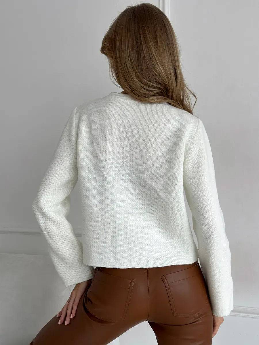 Classy back view of the Ivory Cardigan by Lauven, showcasing its cropped design and warm knit texture.