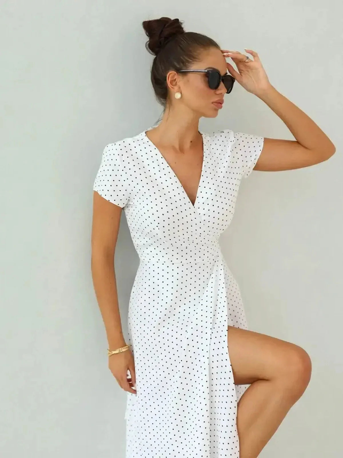 Ivory Dots Maxi Dress with wrap silhouette, short sleeves, and chic high slit, perfect for summer occasions.