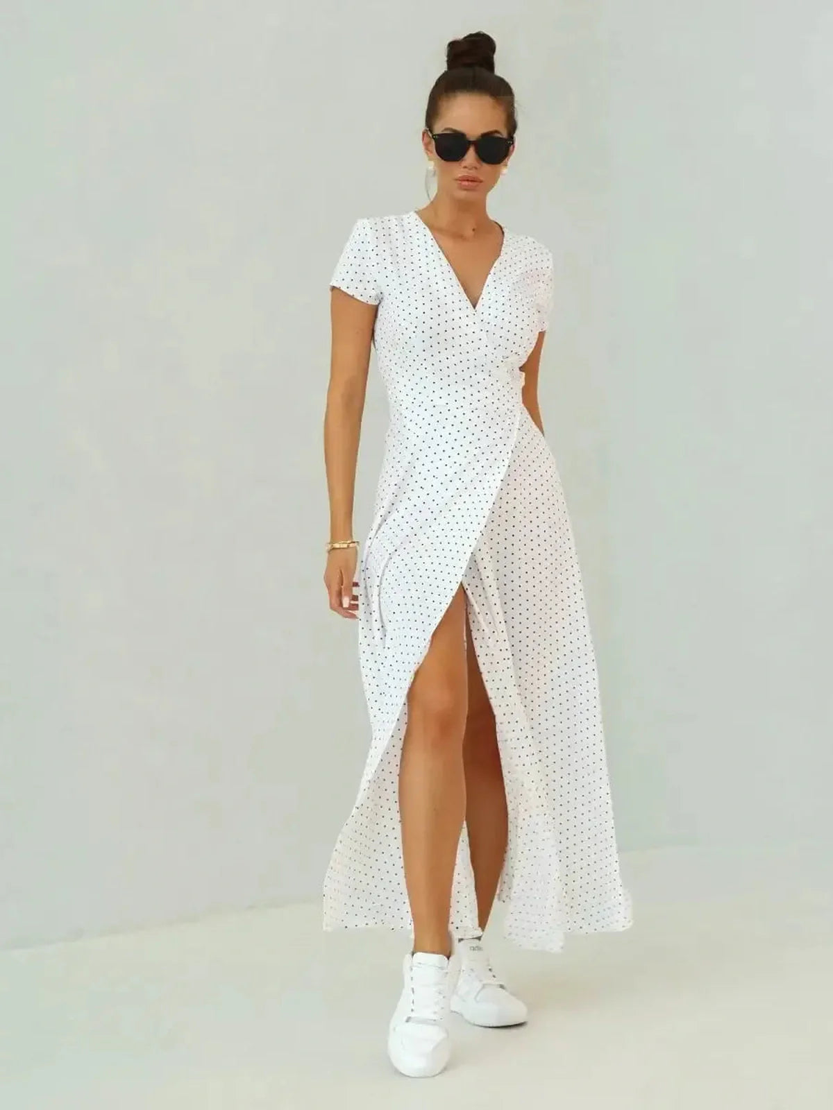 Ivory Dots Maxi Dress featuring wrap silhouette, short sleeves, and high slit, perfect for summer style.