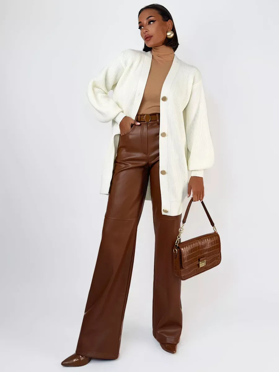 Model wearing the Ivorya Cardigan by Lauven, featuring a longline oversized knit in elegant cream.