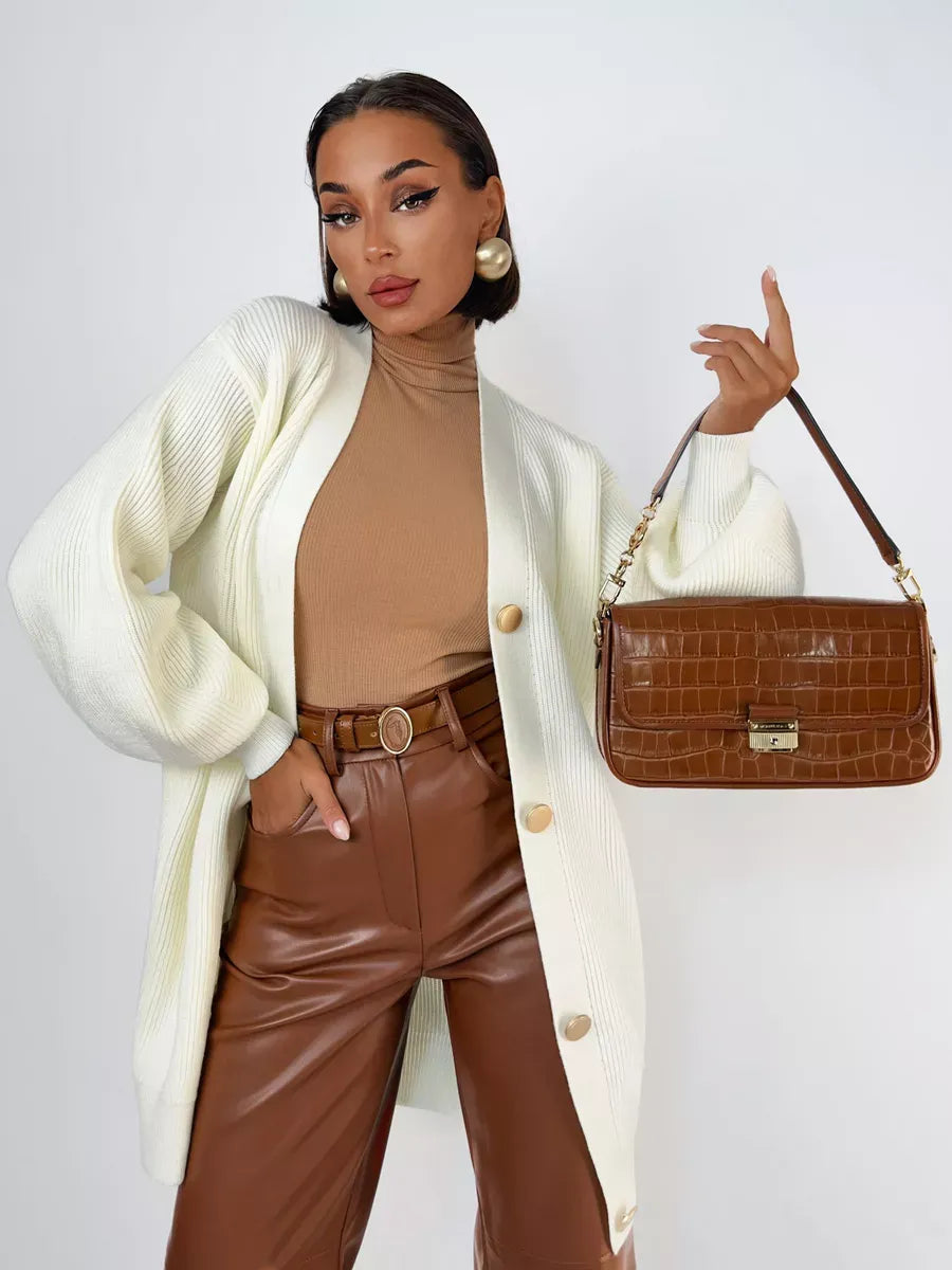 Ivorya Cardigan by Lauven - Longline oversized knit in elegant cream, styled with a chic tan top and brown leather pants.