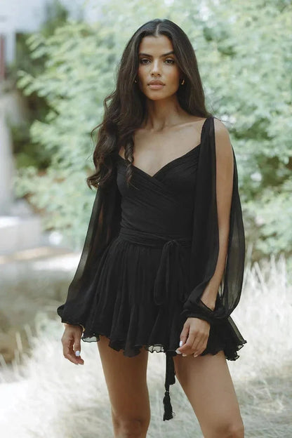 Elegant black mini dress with balloon sleeves, perfect for summer parties and stylish events.