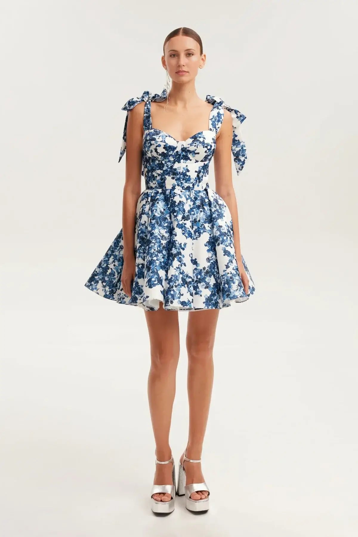Floral A-line mini dress for women with bow straps, perfect for summer parties and special occasions.