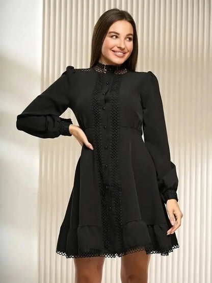 Black mini dress with lace trim and long sleeves, perfect for formal events and special occasions.