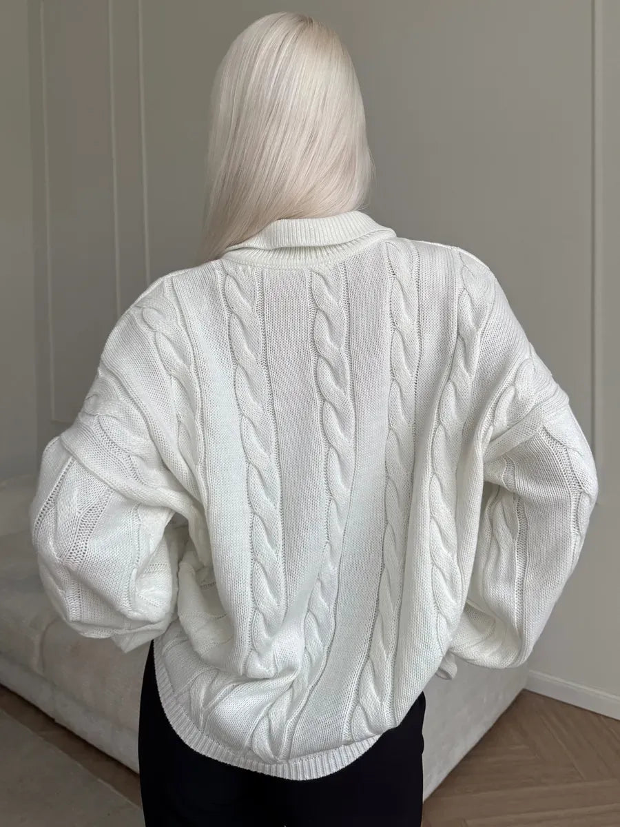 Alabaster Sweater by Lauven shown from the back, featuring a cozy oversized cable knit design in milk-white.