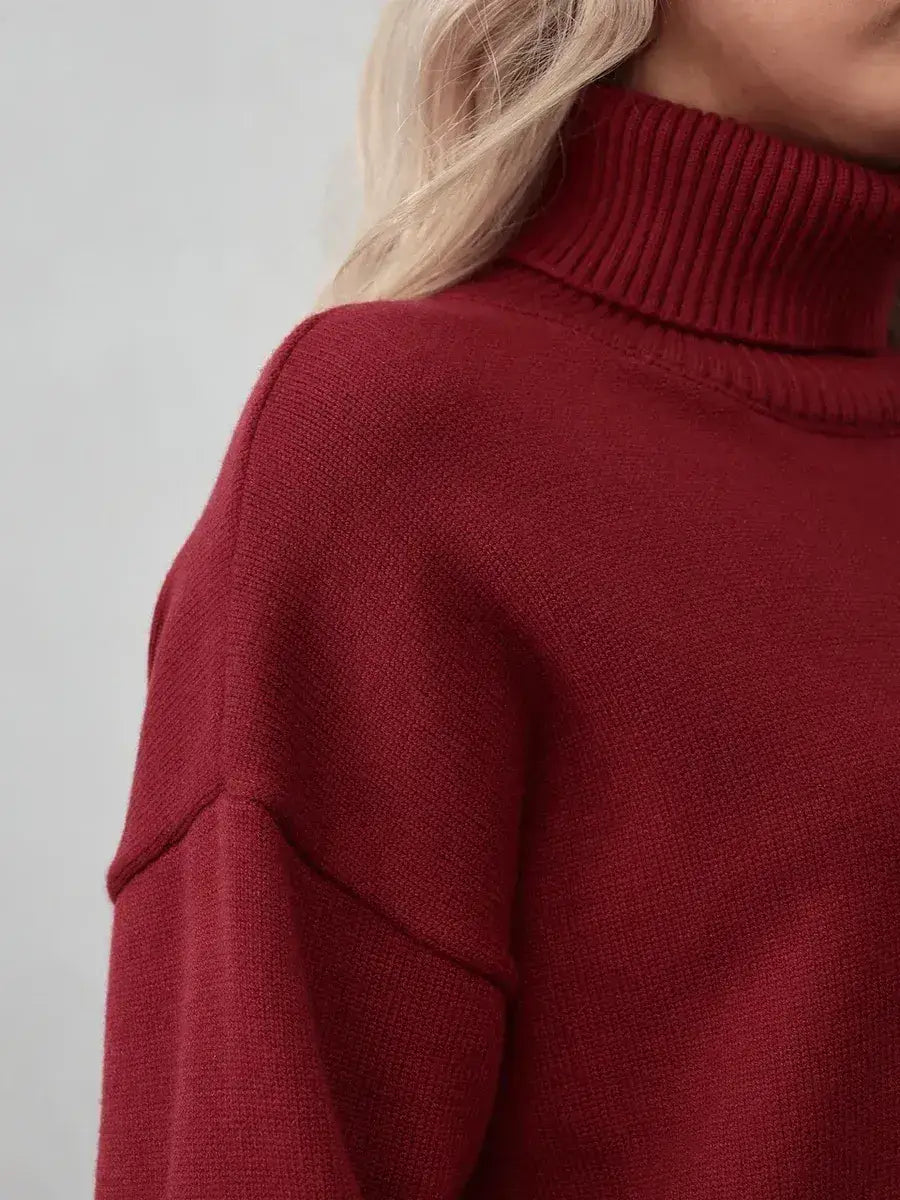 Arden Sweater from Lauven – Close-up of burgundy turtleneck knitwear showcasing soft texture and modern elegance.