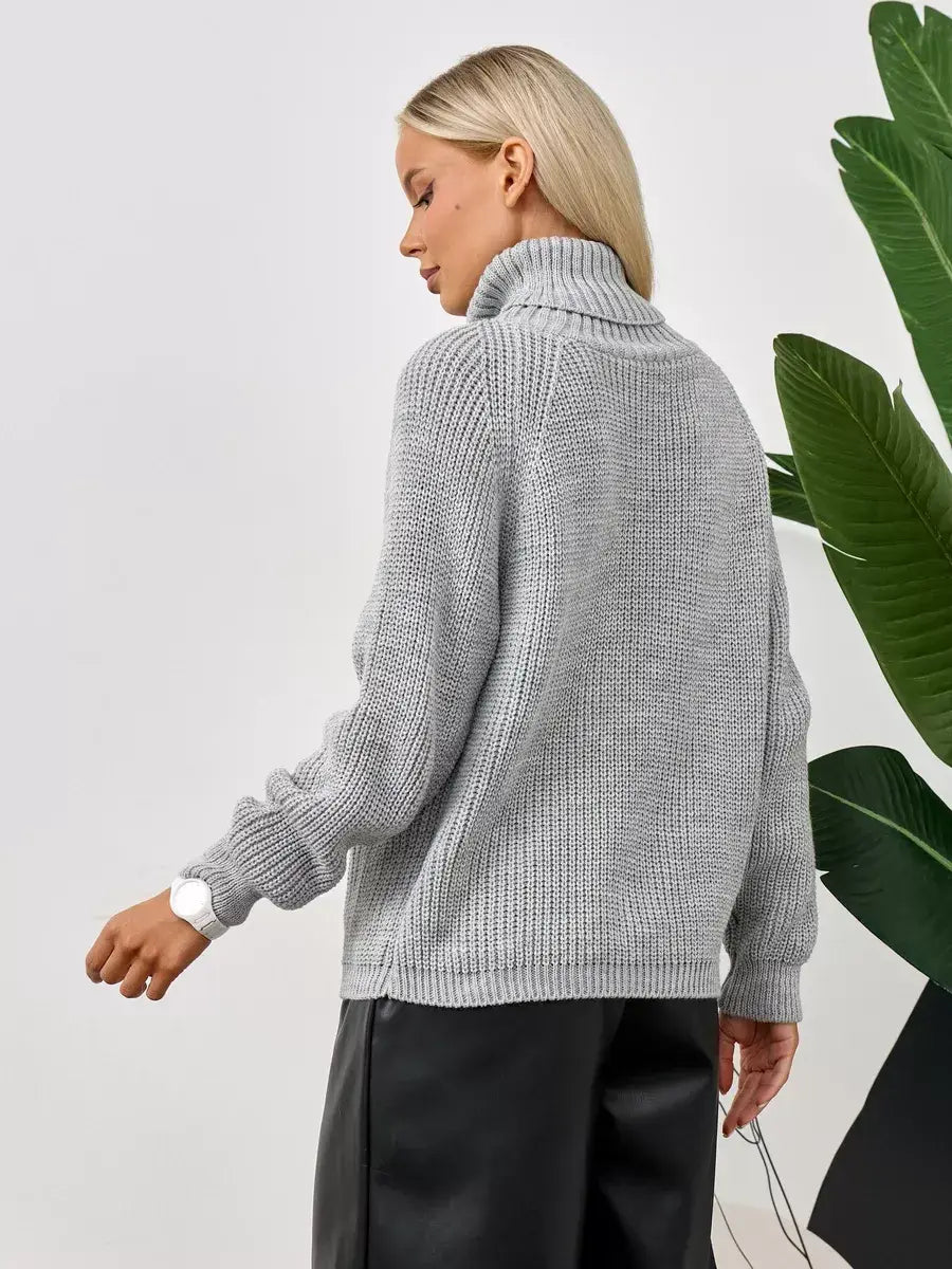 Astra Sweater by Lauven, oversized grey knit with turtleneck, showcasing relaxed silhouette and ribbed texture.