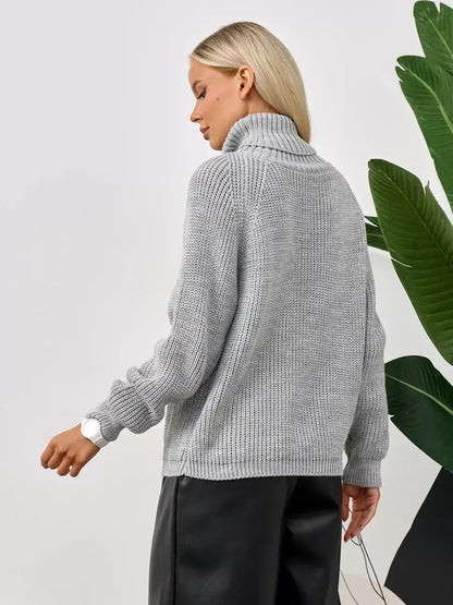 Astra Sweater by Lauven, oversized grey knit with turtleneck, showcasing relaxed silhouette and ribbed texture.