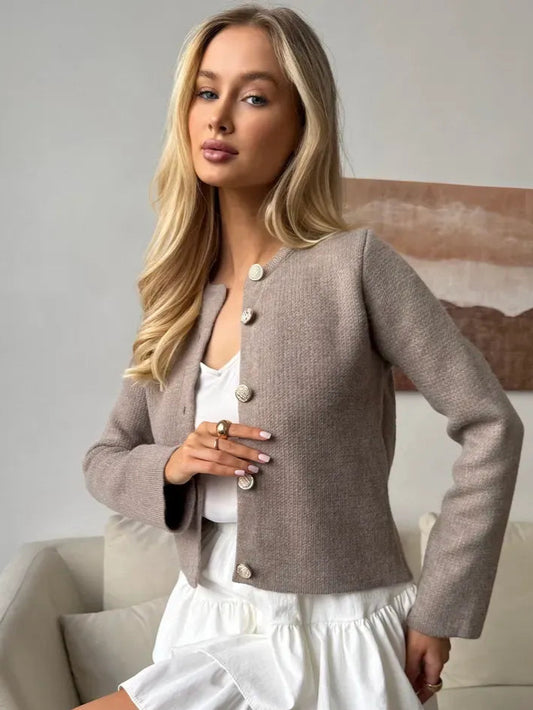 Aveline Cardigan by Lauven in soft cappuccino color with decorative buttons, featured on a model.