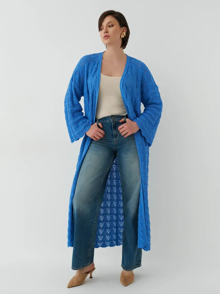 Model wearing a lightweight Azure Cardigan from Lauven, styled with jeans for a summer look.