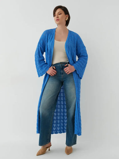 Model wearing a lightweight Azure Cardigan from Lauven, styled with jeans for a summer look.