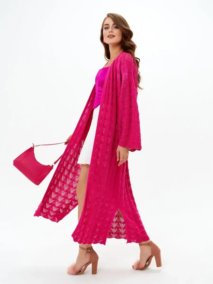 Model wearing a lightweight Berry Cardigan in vibrant raspberry, styled for summer with chic accessories by Lauven.